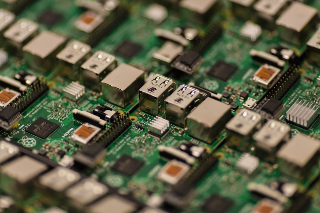 pexels-photo-57007 Detailed shot of a Raspberry Pi circuit board showcasing its components, USB ports, and microchips.