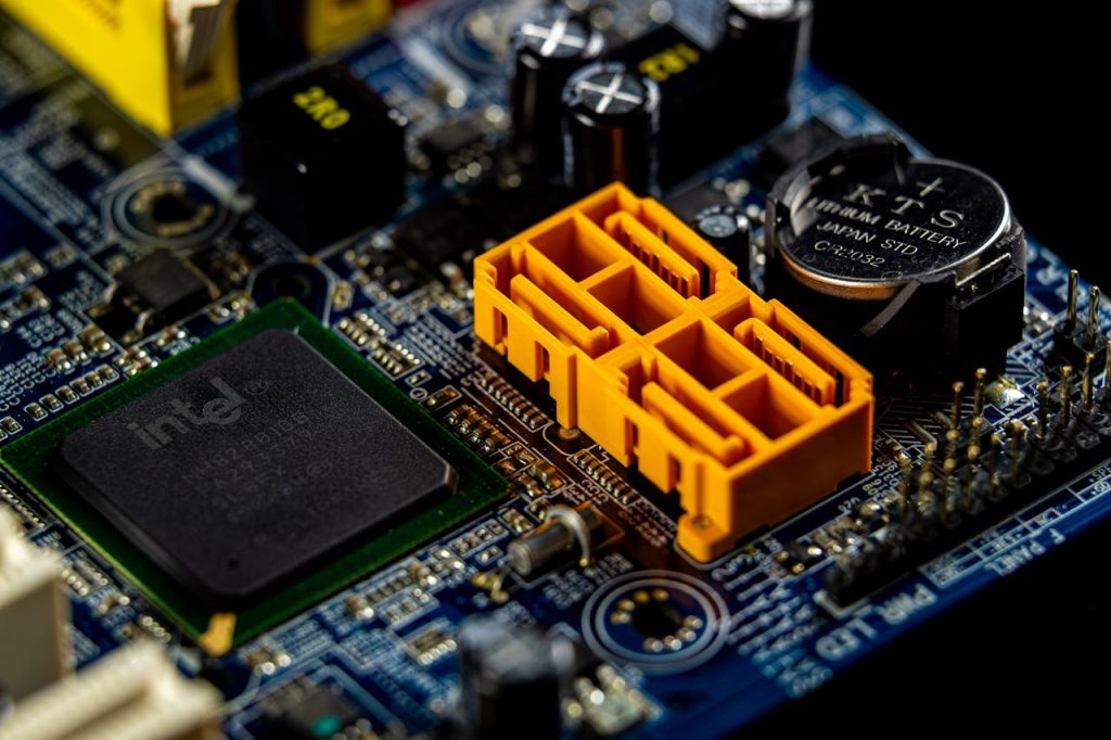 pexels-photo-6636462 Detailed view of a computer motherboard showcasing an Intel microprocessor and electronic components.